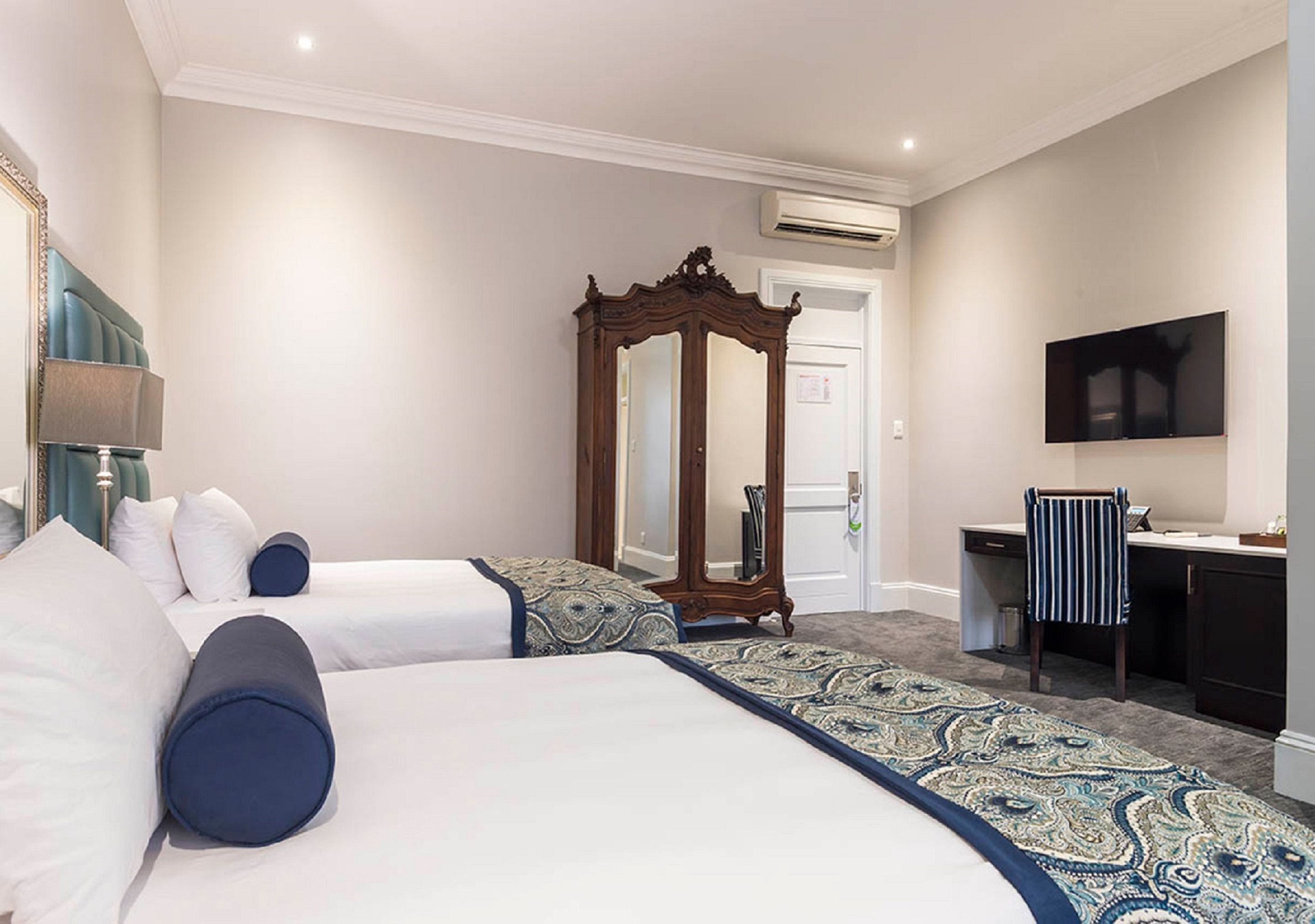 family room | in-room safe, desk, blackout curtains, iron/ironing board