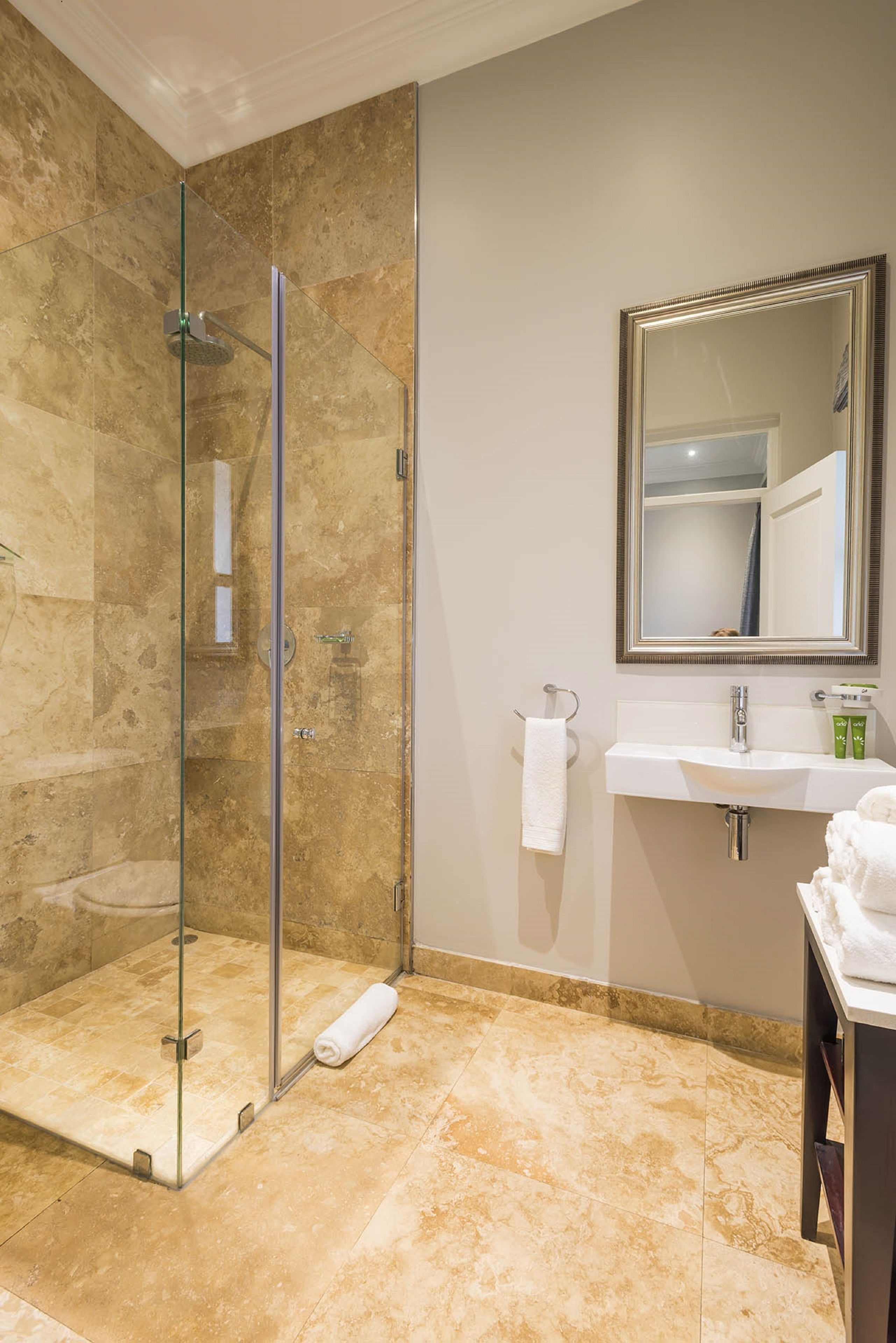 family room | bathroom | deep-soaking bathtub, free toiletries, hair dryer, slippers