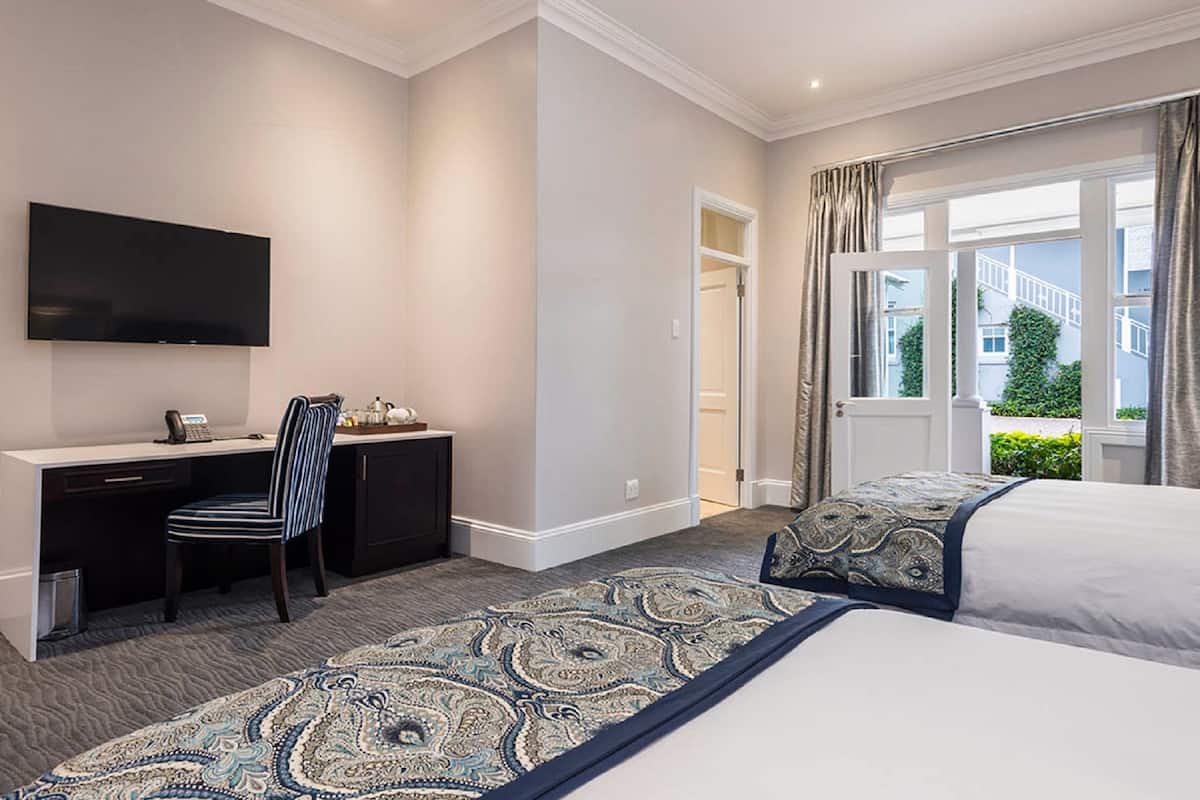 family room | in-room safe, desk, blackout curtains, iron/ironing board