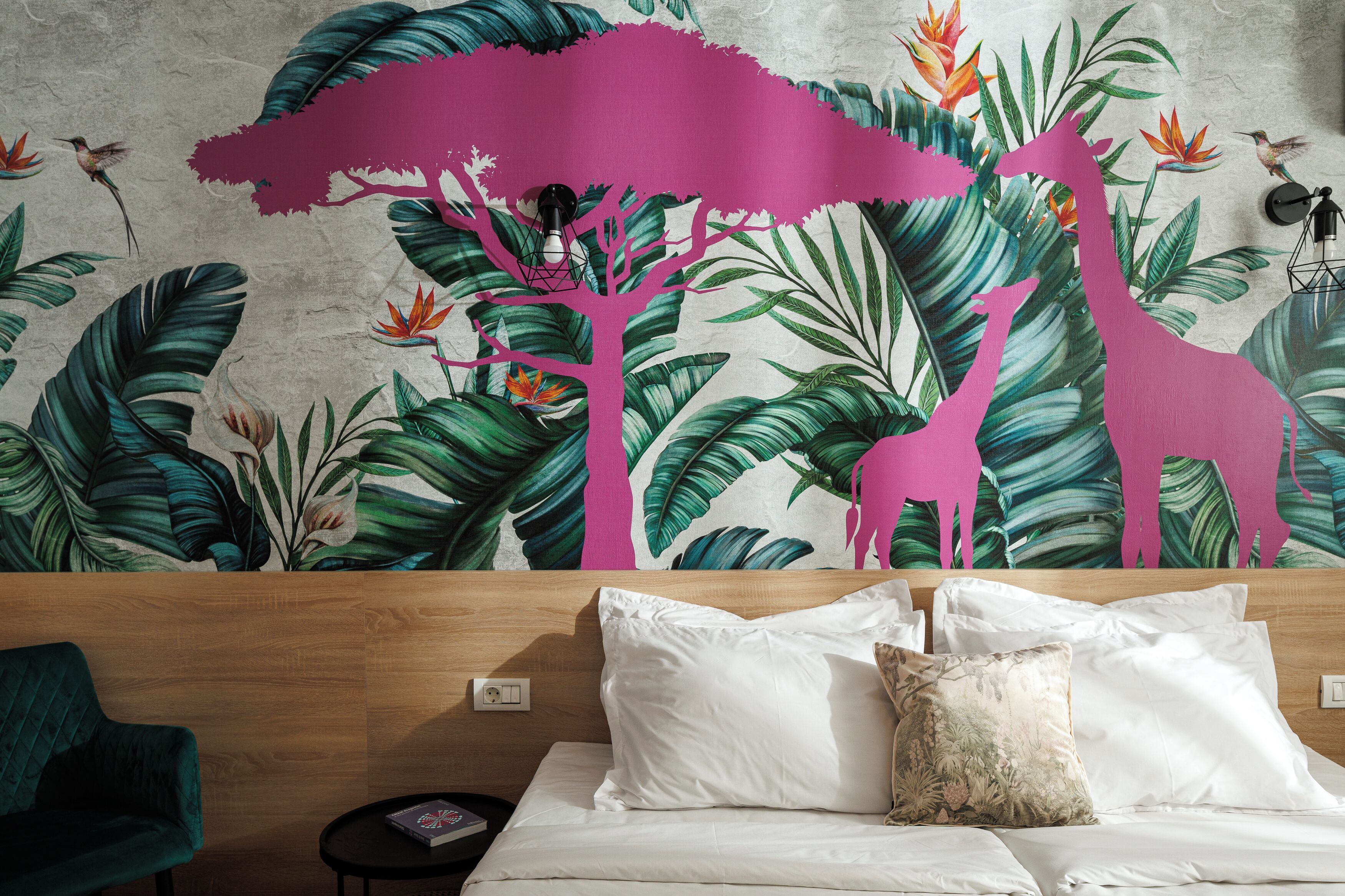 A bedroom with a large bed, white bedding, and a vibrant tropical mural on the wall.