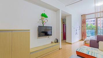 Deluxe-Doppelzimmer | Wohnbereich | Flachbildfernseher