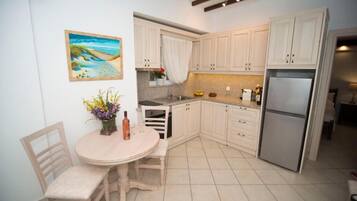 Apartment, 2 Bedrooms | Private kitchen | Coffee/tea maker, fridge, stovetop, electric kettle
