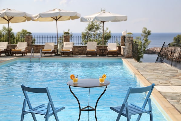Outdoor pool, pool umbrellas, pool loungers