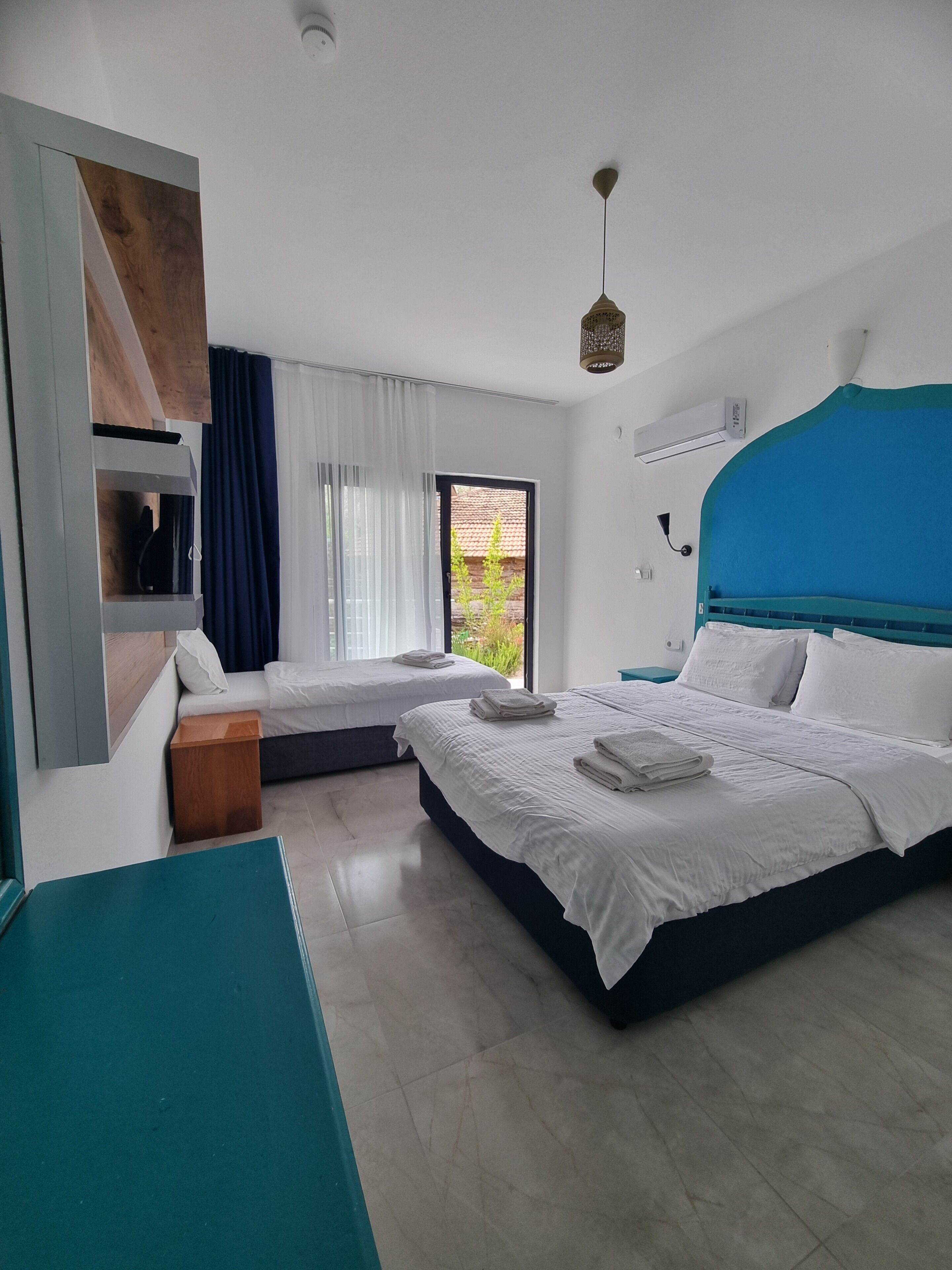 Triple Room, Balcony, Garden View | Individually decorated, individually furnished, laptop workspace