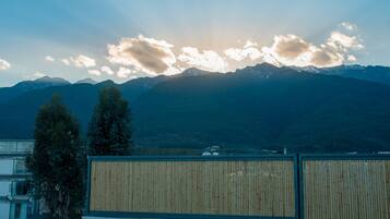 A mountain range with a clear sky and a few clouds.