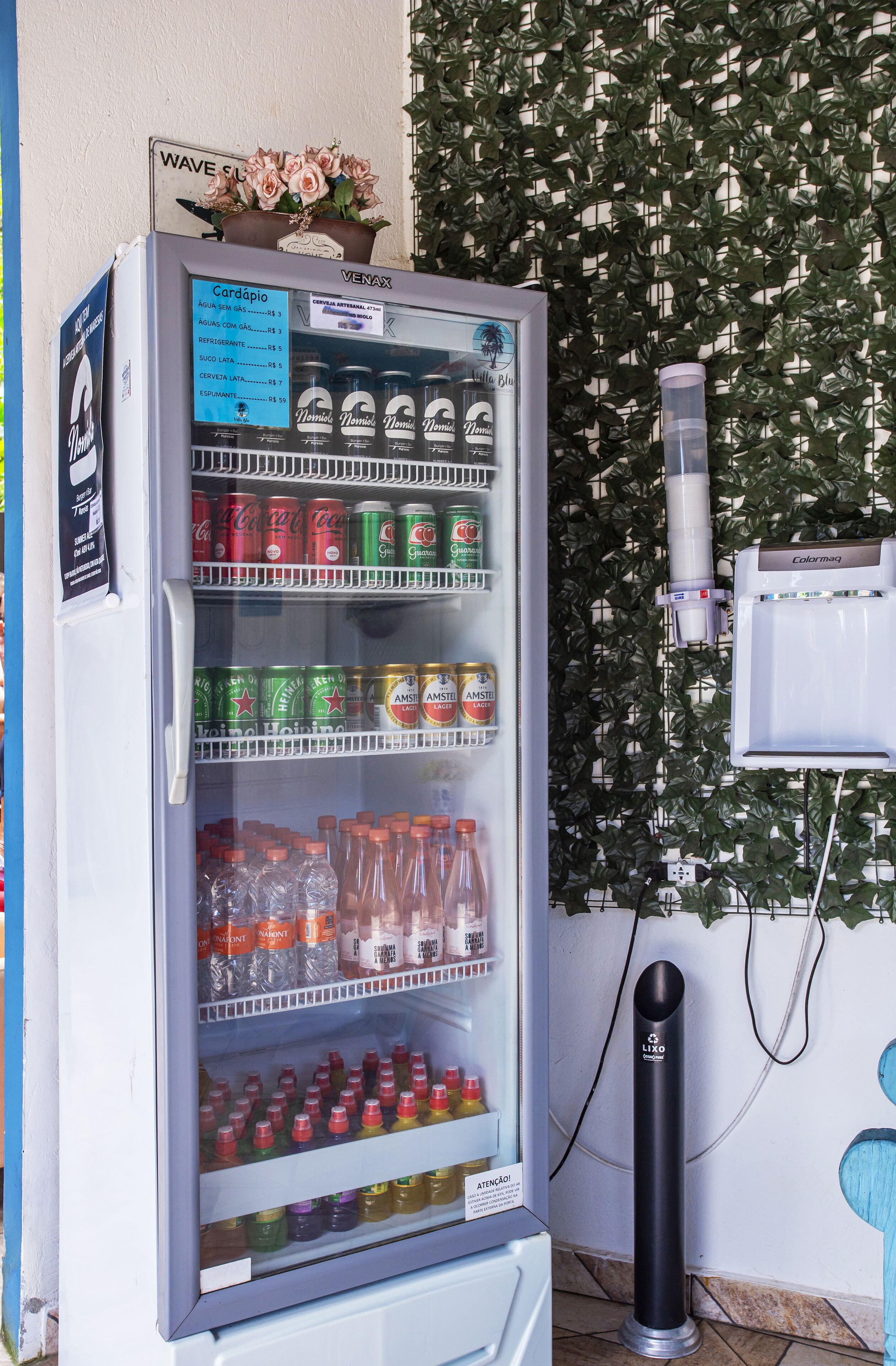 A vending machine with various beverages and snacks.