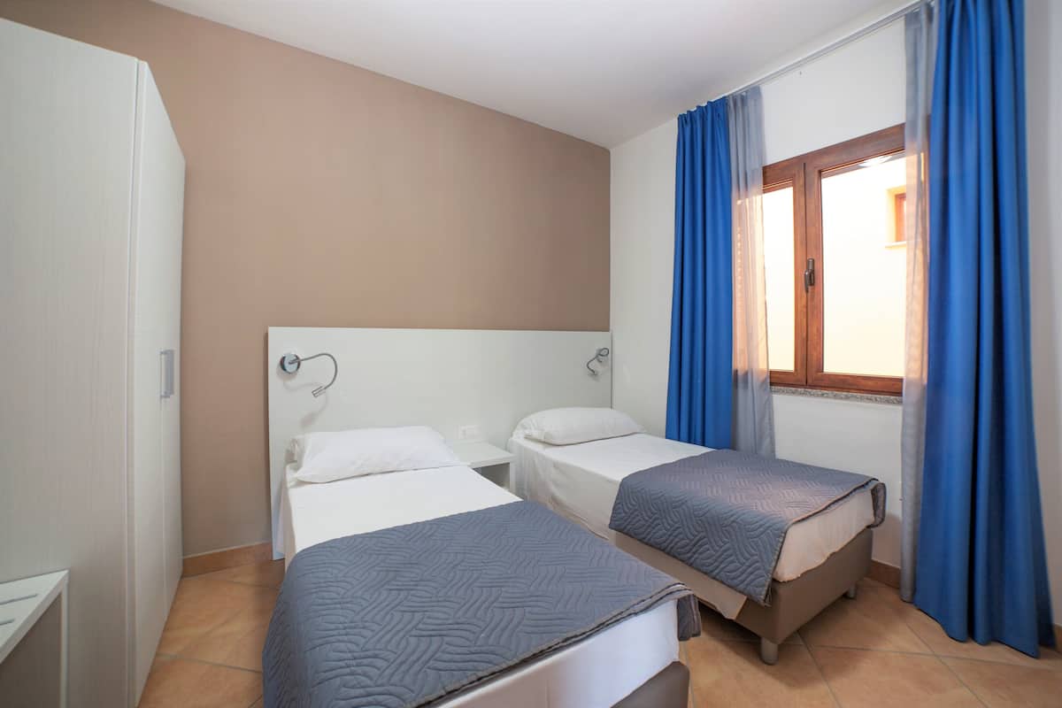 1 bedroom, premium bedding, blackout curtains, iron/ironing board