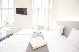 Hypo-allergenic bedding, desk, laptop workspace, blackout curtains