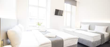 Hypo-allergenic bedding, desk, laptop workspace, blackout curtains