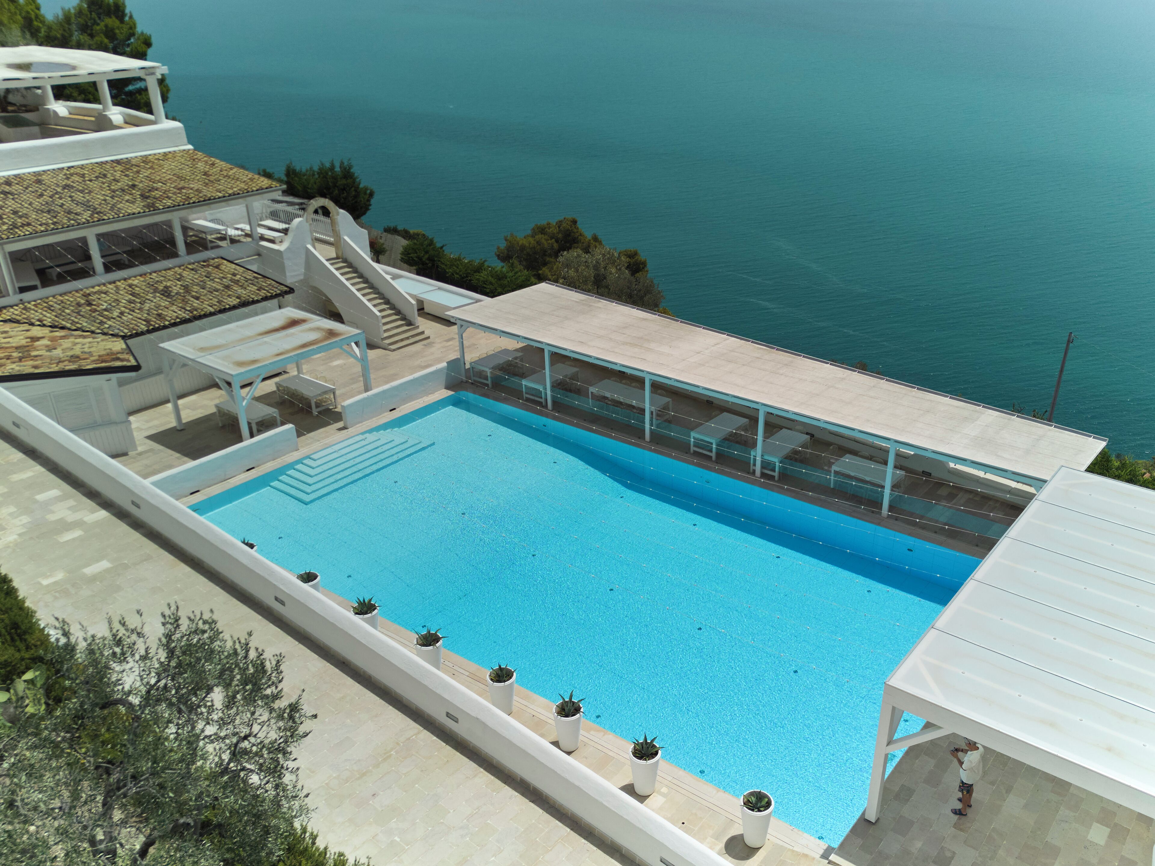 Seasonal outdoor pool, a rooftop pool, pool umbrellas, pool loungers