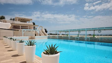 Seasonal outdoor pool, a rooftop pool, pool umbrellas, pool loungers