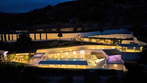 A modern hotel with a pool area, multiple guest rooms, and a landscaped garden. - La Locanda del Carrubo (Mattinata)