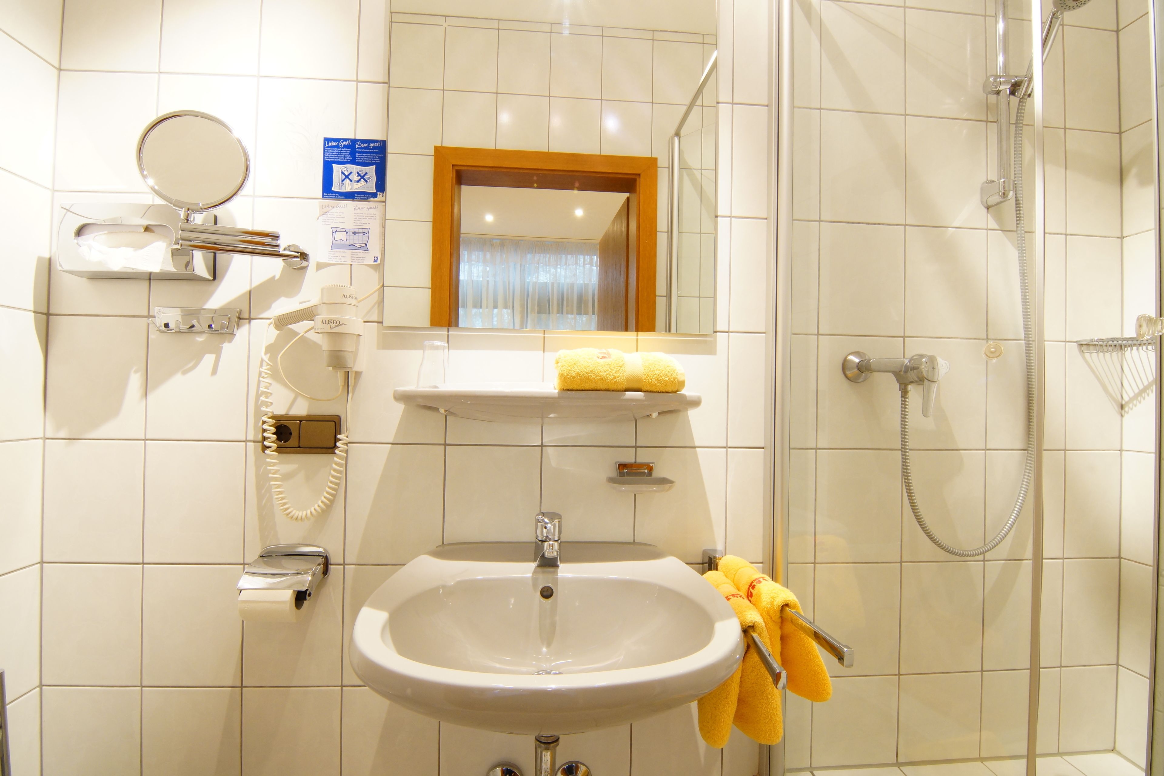 shower, free toiletries, hair dryer, towels