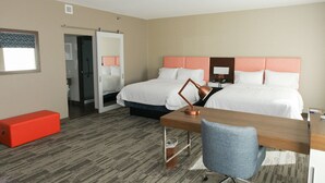 A hotel room with two beds, a desk, a chair, and a red bench. - Hampton Inn & Suites Lafayette Medical Center, CO (Lafayette)