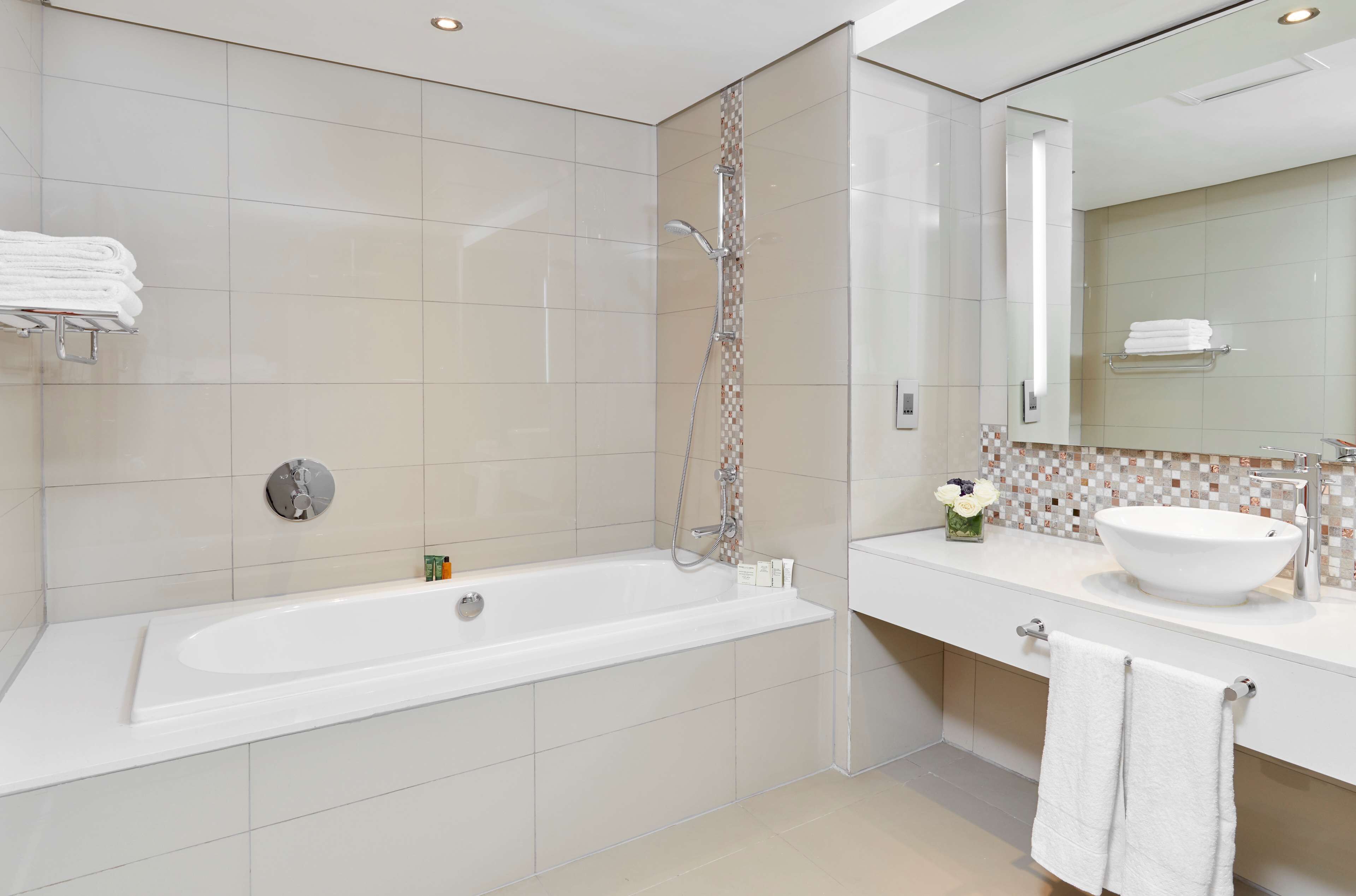 junior suite, 1 king bed | bathroom | separate bathtub and shower, deep-soaking bathtub, free toiletries