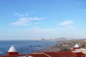A coastal view with buildings and a clear sky.