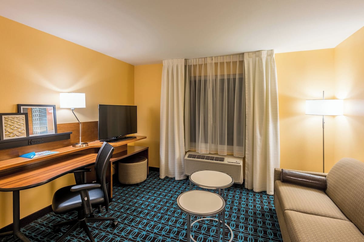 Suite, 1 King Bed with Sofa bed | Living area | 40-inch TV with cable channels, Netflix