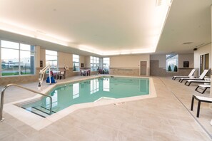 Indoor pool, open 10:00 AM to 10:00 PM, pool loungers