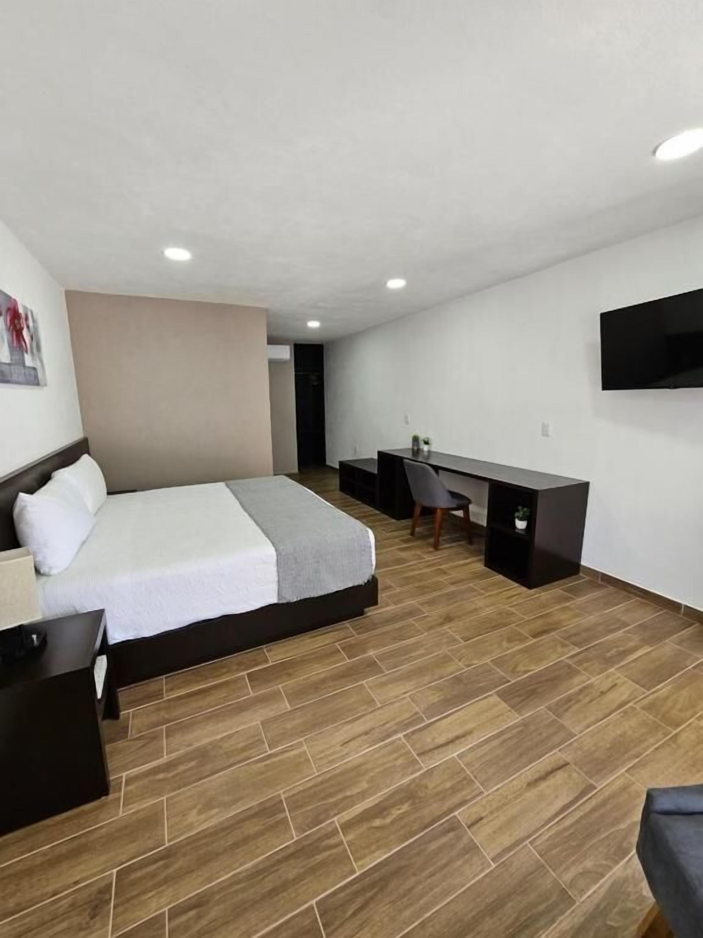 Chambre Deluxe, 1 chambre | Rideaux d’obscurcissement, fer et planche à repasser