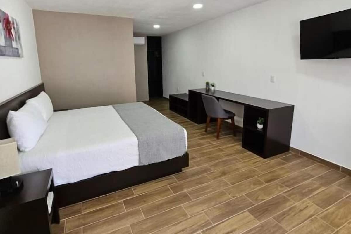 Chambre Deluxe, 1 chambre | Rideaux dâobscurcissement, fer et planche Ă repasser