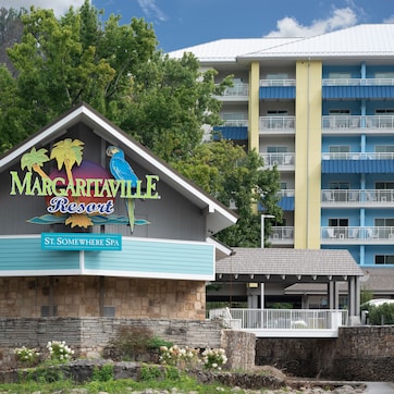 A resort building with a sign for 'Margaritaville Resort' and 'St. Somewhere Spa'.
