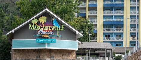 A resort building with a sign for 'Margaritaville Resort' and 'St. Somewhere Spa'.