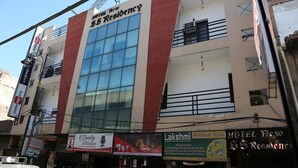 A hotel with a modern facade, multiple floors, and a prominent sign for 'Hotel New S.S Residency'. - Hotel New SS Residency (Amritsar)