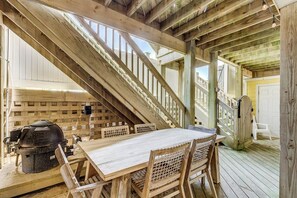 Enjoy outdoor dining and socializing on the deck with a table and chairs, and access to a barbecue grill.