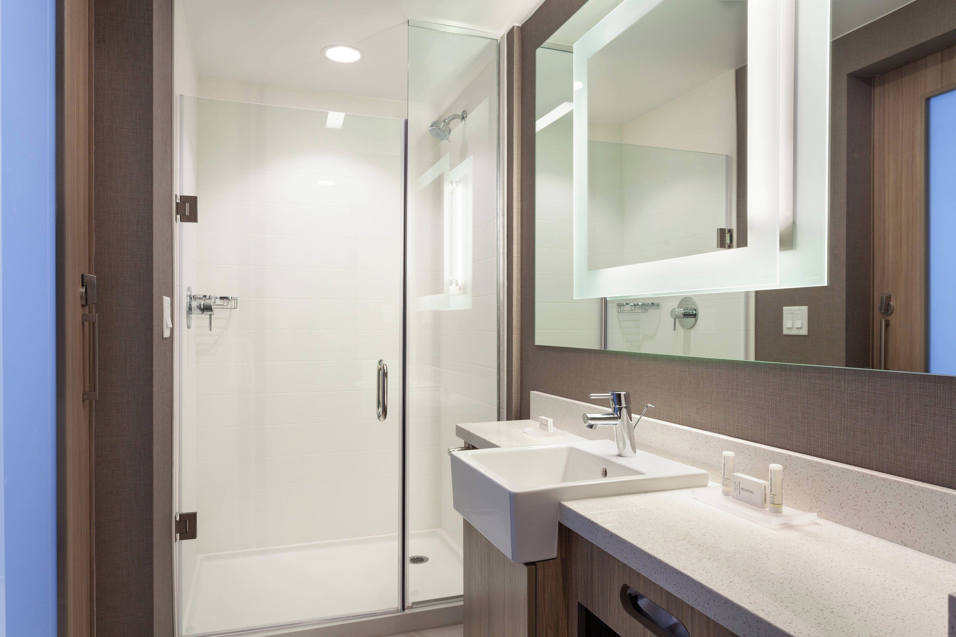 designer toiletries, hair dryer, towels