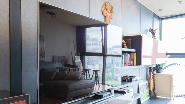 A modern living room with a sofa, a coffee table, and a bookshelf. - Gangnam Galaxy Apartment 1 (Seoul)