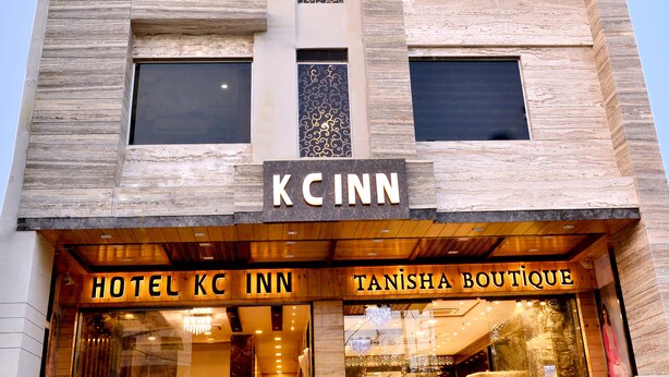 A hotel building with a modern facade, featuring a prominent 'KC INN' sign above the entrance. - Kc Inn (Ajmer)