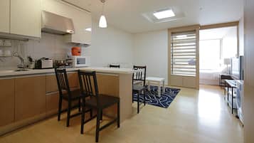 Royal Apartment, 1 Queen Bed, Refrigerator & Microwave | Living area | TV