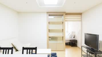 Royal Apartment, 1 Queen Bed, Refrigerator & Microwave | Living area | TV