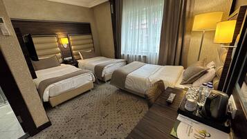Triple Room | Minibar, in-room safe, desk, free WiFi