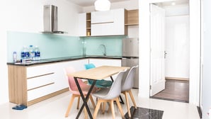 2 Bedrooms Apartment | Private kitchenette | Fridge, microwave, stovetop, electric kettle - Riverside Apartment in Monarchy Apartment (Da Nang)