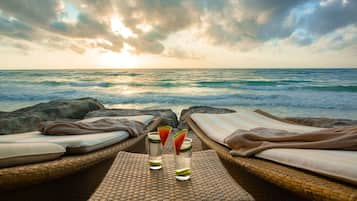 On the beach, sun loungers, beach umbrellas, beach towels