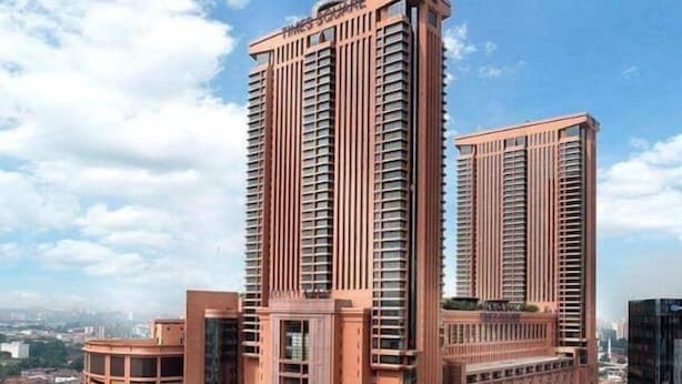 A high-rise building with a modern architectural design, featuring multiple balconies and a prominent entrance. - Charisma Hotel (Kuala Lumpur)