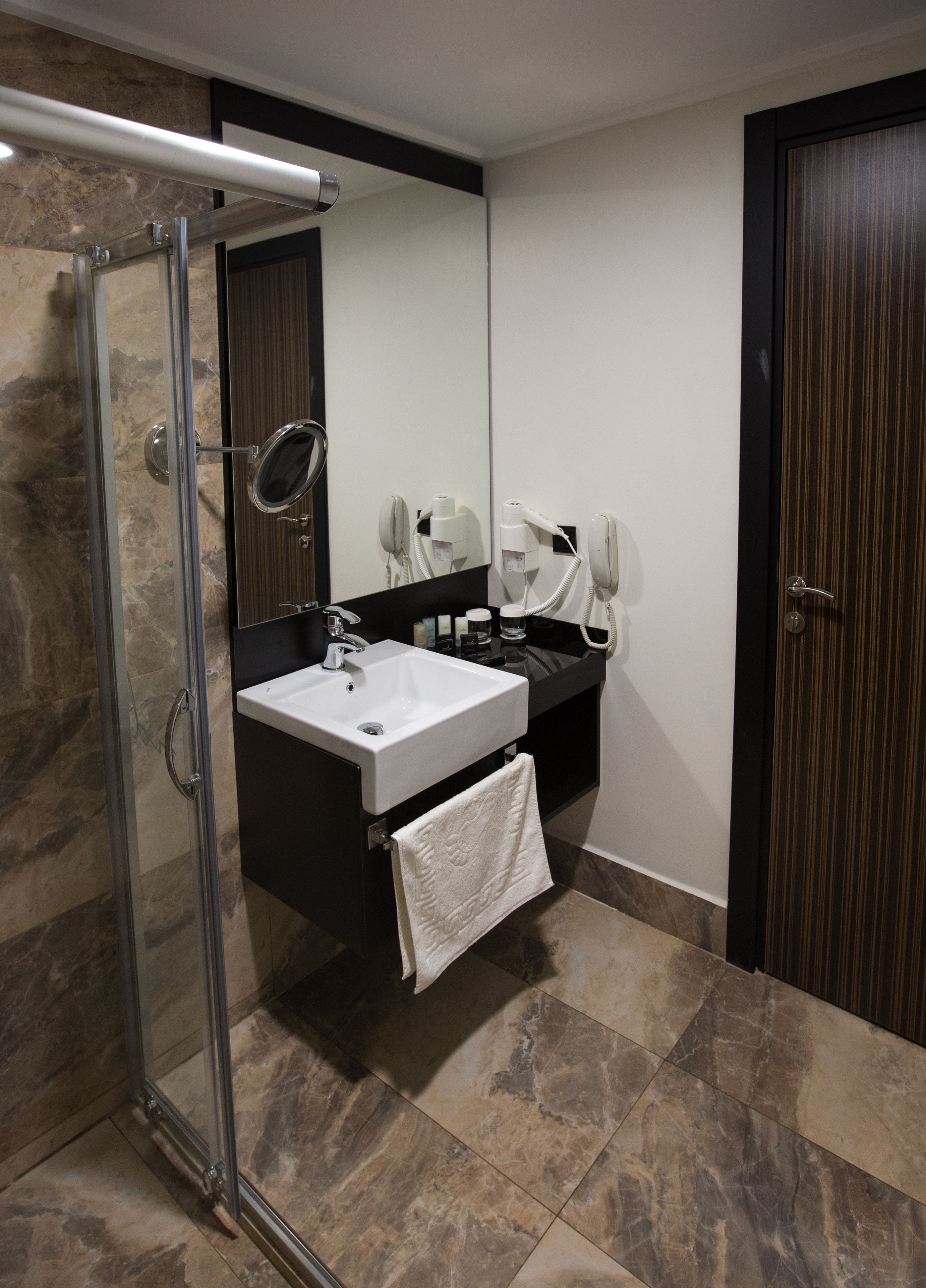 shower, free toiletries, hair dryer, towels