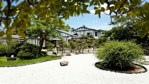 A traditional Japanese-style building with a gravel pathway leading to the entrance. - Kaike Fuga (Yonago)