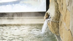 A stone wall with a water feature, including a small waterfall and a pool. - Kaike Fuga (Yonago)