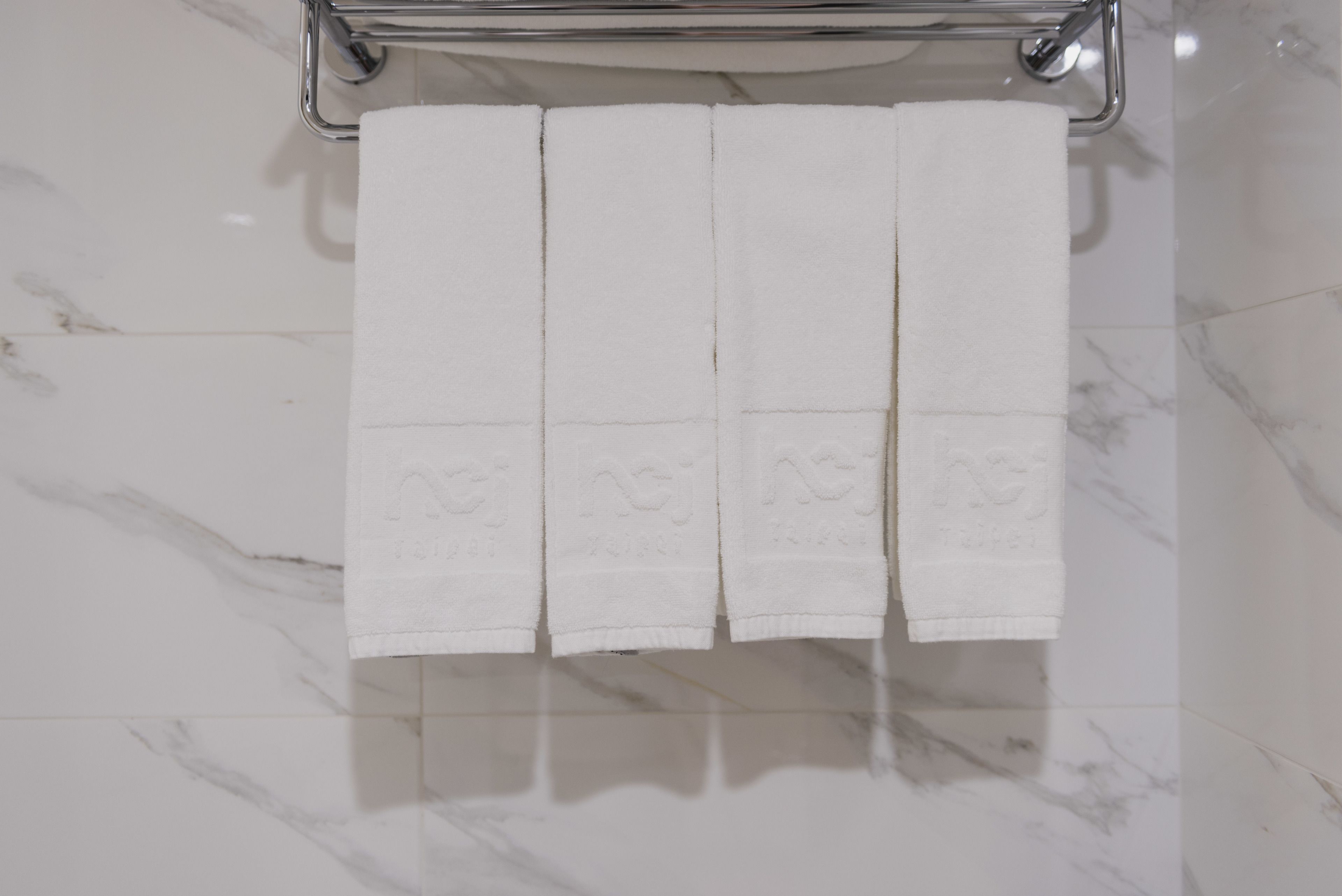 deluxe quadruple room, city view | bathroom | rainfall showerhead, free toiletries, hair dryer, slippers