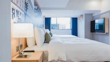 Habitación cuádruple Deluxe, vista a la ciudad | Edredón y artículos del minibar gratis