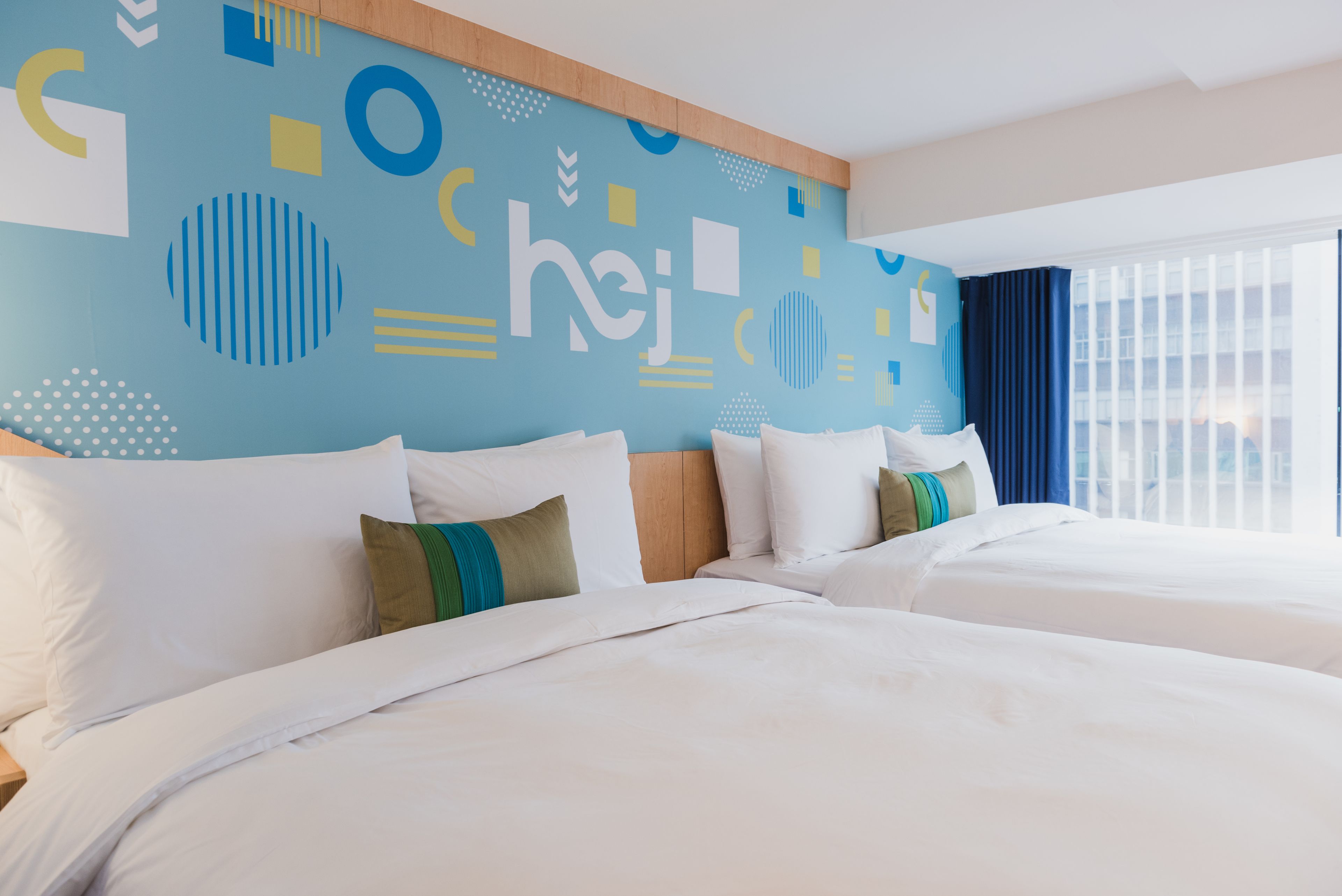 deluxe quadruple room, city view | down duvets, free minibar, in-room safe, desk