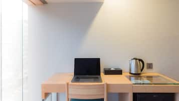 Copriletto in piuma, minibar con snack e bevande gratuite