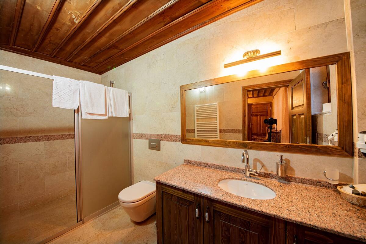 superior room | bathroom | shower, hair dryer, slippers, towels