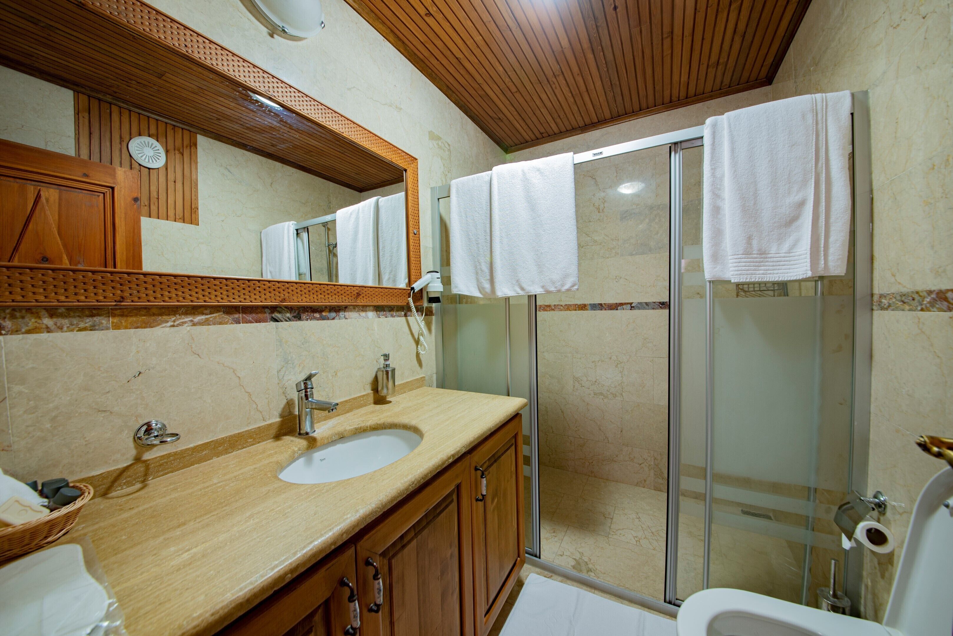 superior triple room | bathroom | shower, hair dryer, slippers, towels