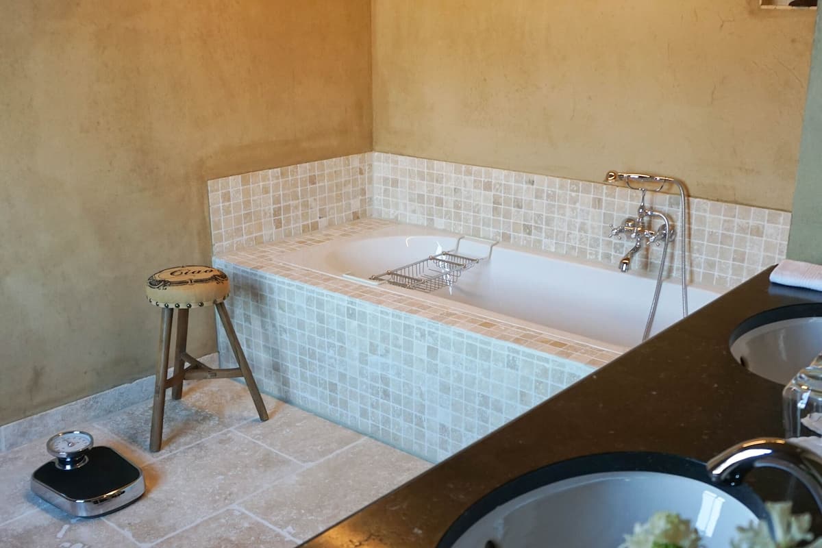 luxury double room, 1 king bed | bathroom | separate bathtub and shower, rainfall showerhead, designer toiletries