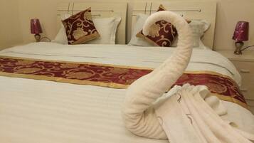 Appartement, 1 slaapkamer | 1 slaapkamer, een kluis op de kamer, een strijkplank/strijkijzer