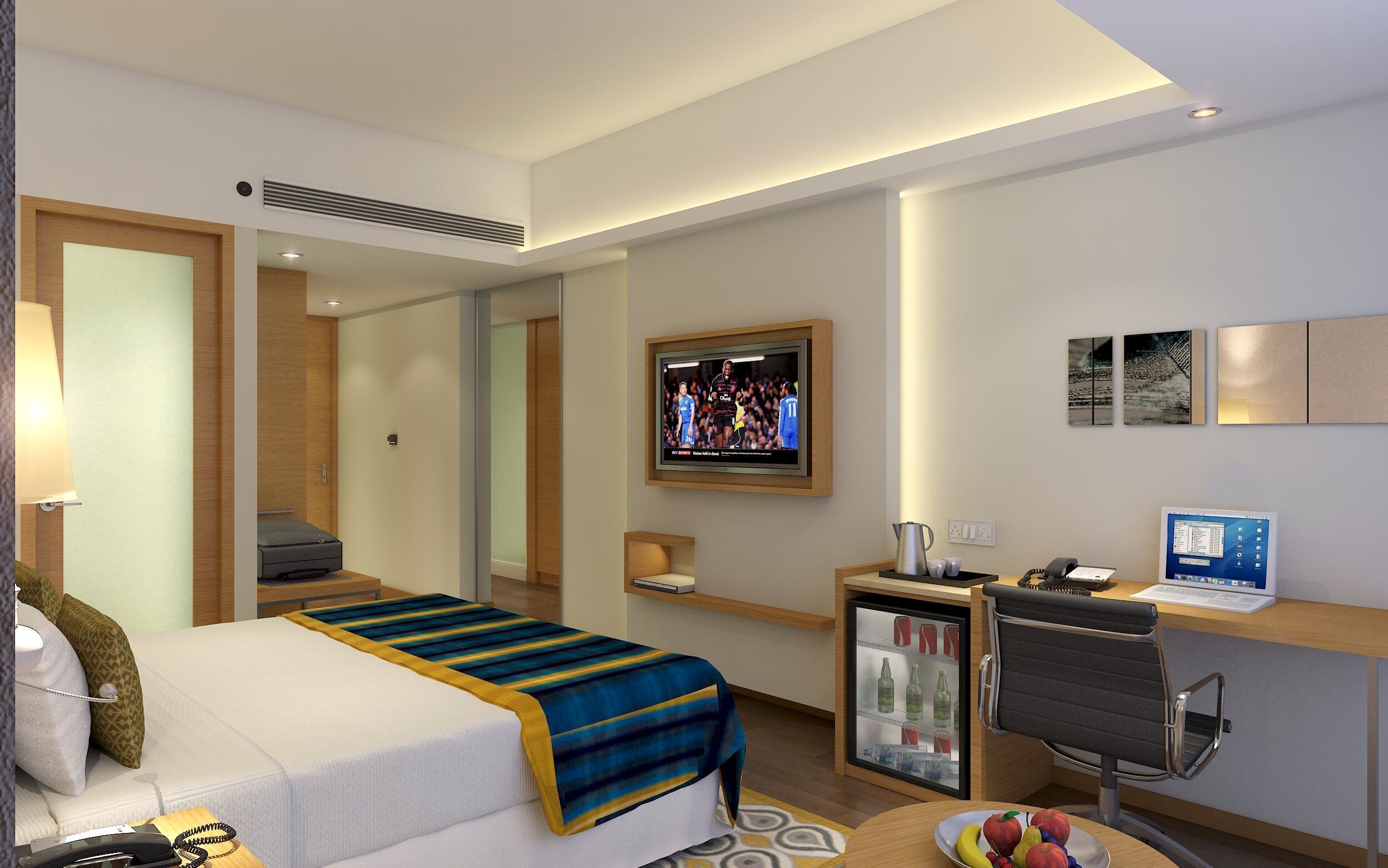 Een hotelkamer met een bed, een bureau, een televisie, een koelkast en een koffiezetapparaat.