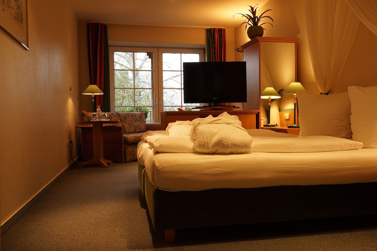 Junior suite | Een bureau, verduisterende gordijnen, gratis wifi, beddengoed